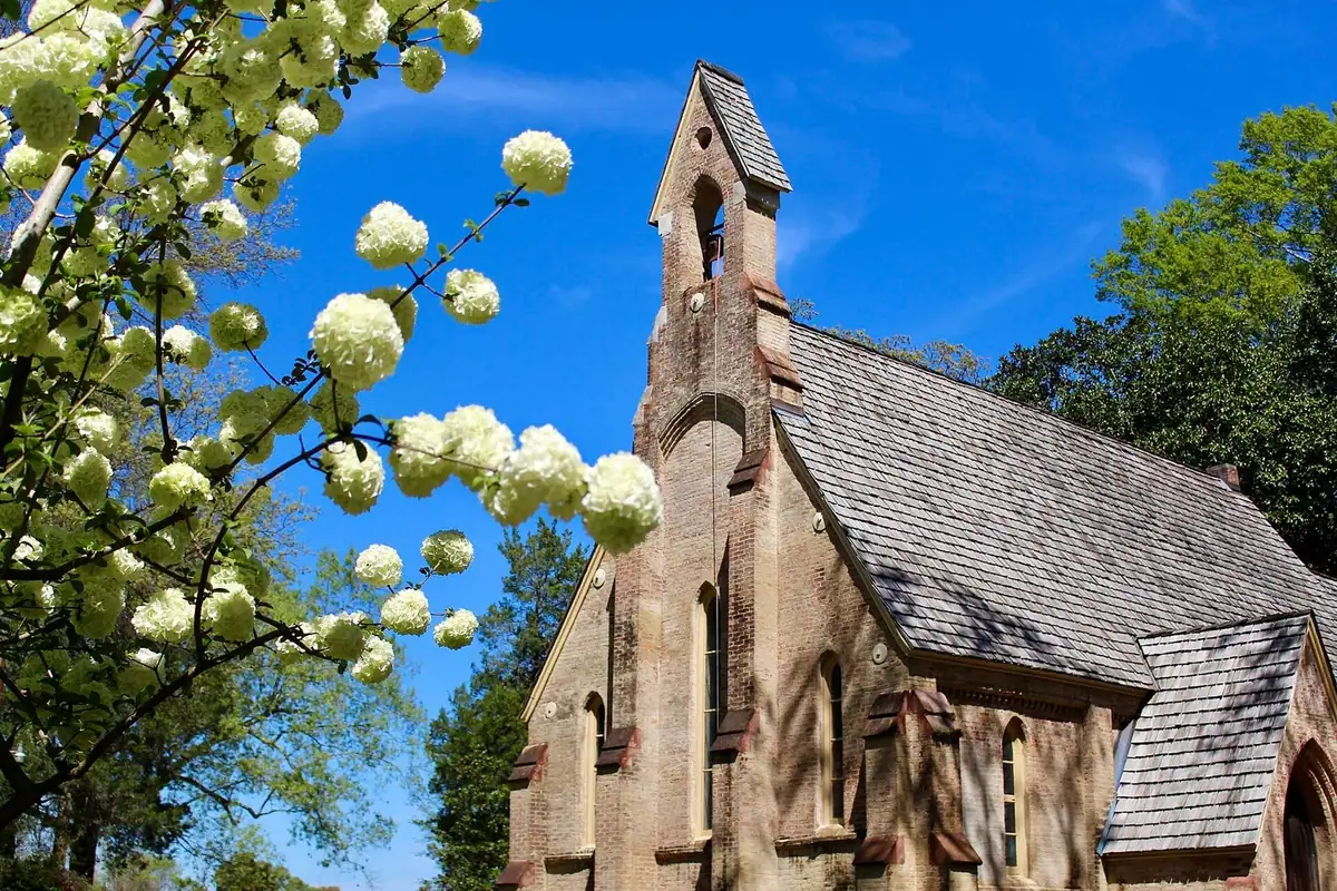 The Chapel of the Cross in Madison County, Mississippi, with spring blooms in the foreground